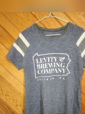 Augusta Sportswear Levity Brewing Company Medium Blue Gray And White Striped Top